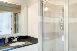 Secondary en suite has glass walk-in shower. 